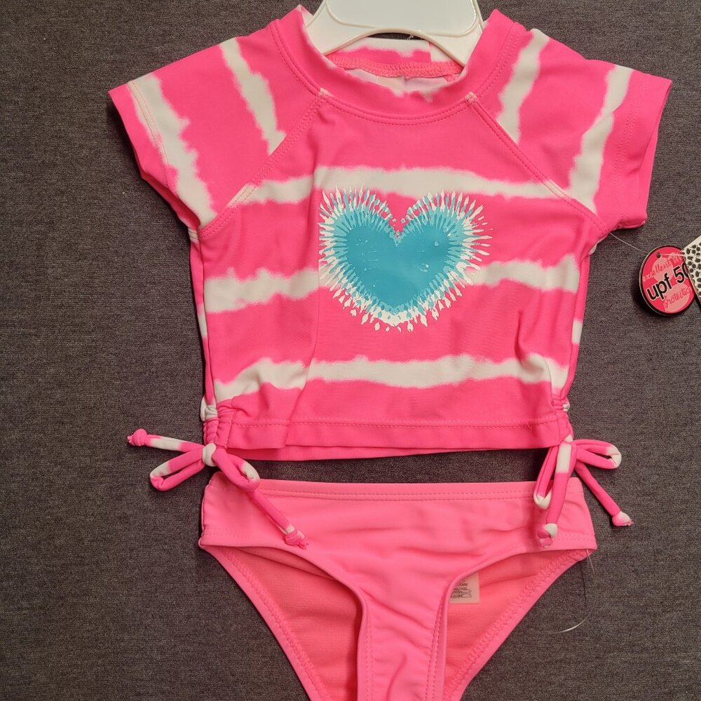 Infant girl bathing suit, kenzie girl, size 12 mos. New with tags